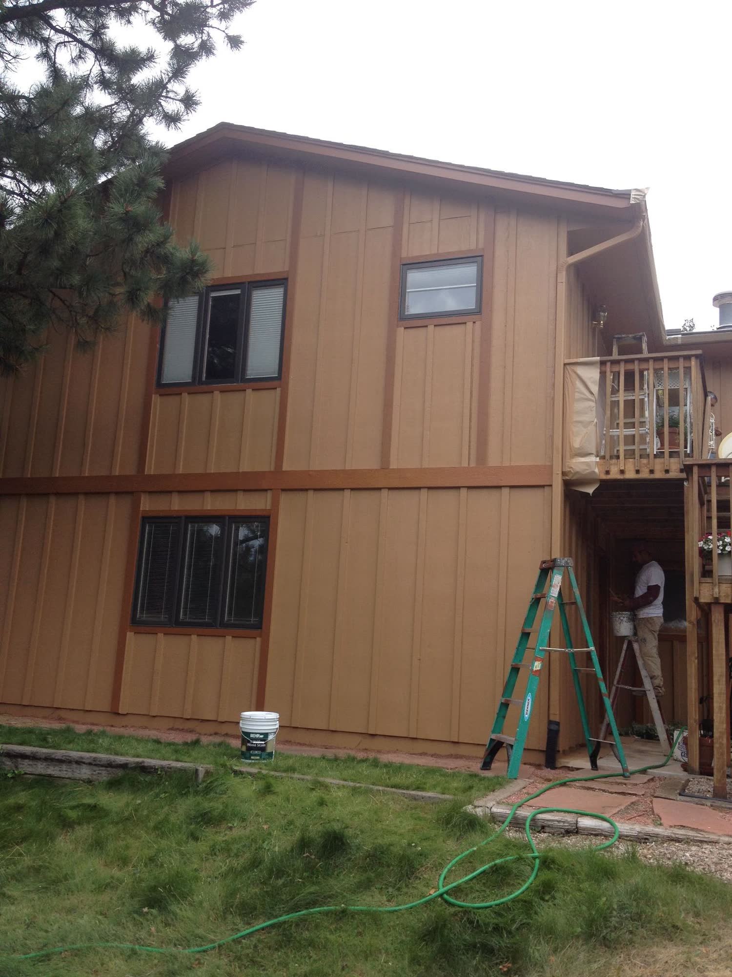 After: warm caramel-painted board-and-batten Colorado home