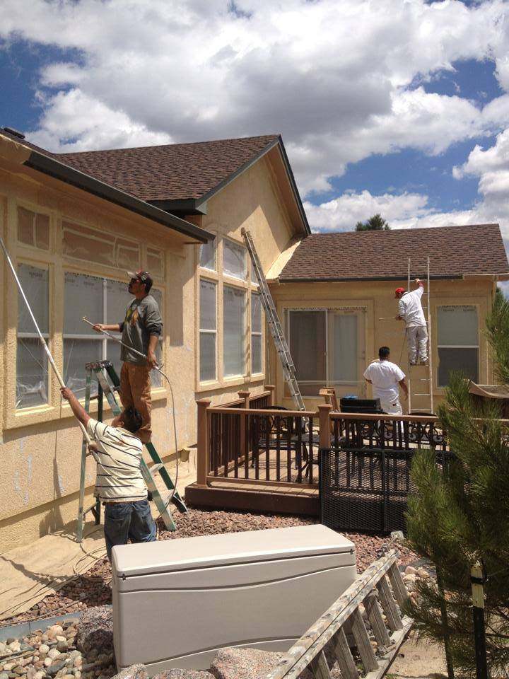 Confident Coatings crew at work on a Colorado stucco exterior